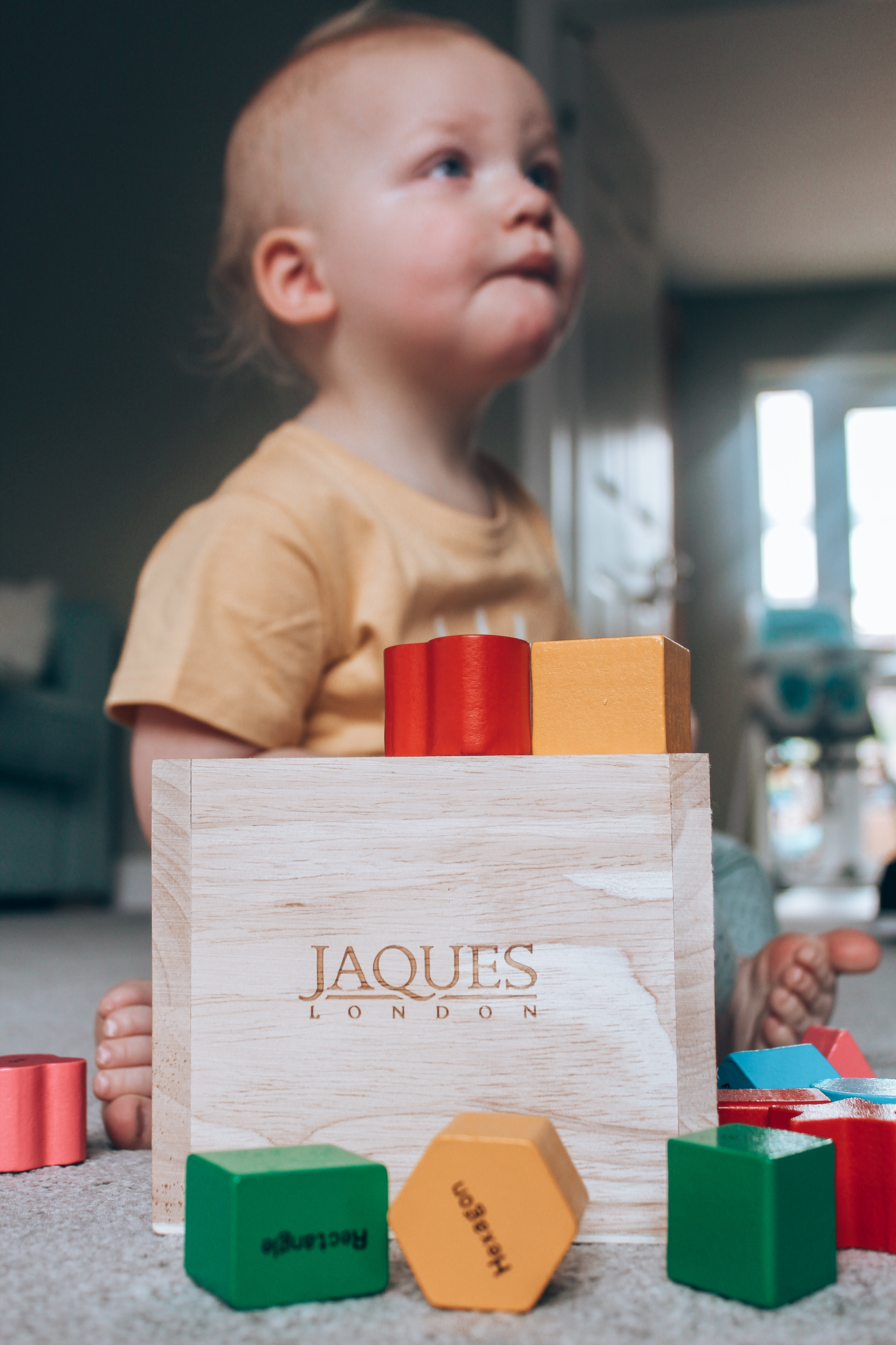 aidan playing with wooden toys